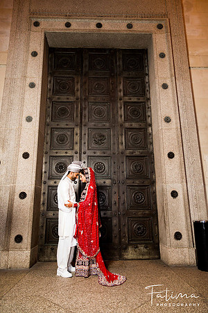 posing by a old wooden door