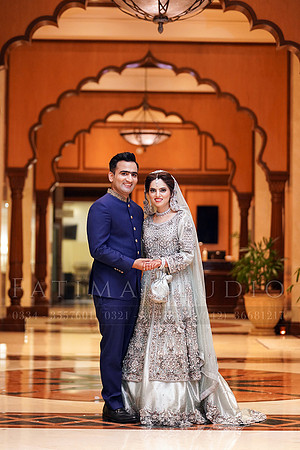 Couple posing for a photoshoot in Avari Hotel Lahore